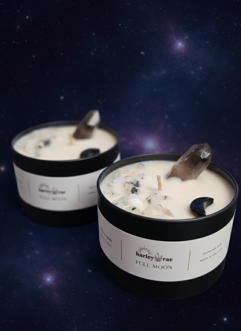Two candles labeled 'Full Moon' by Harley Rae on a dark background with star-like elements.