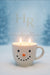 Snowman-shaped candle with Toasted Marshmallow Scent in a mug with 'HR HarleyRae' branding against a snowy background.