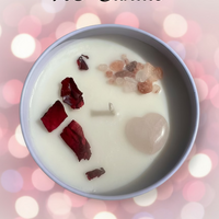 Candle with visible wicks and debris in a bowl with 'XO Candle' and 'HarleyRae' text on a blurred light background.